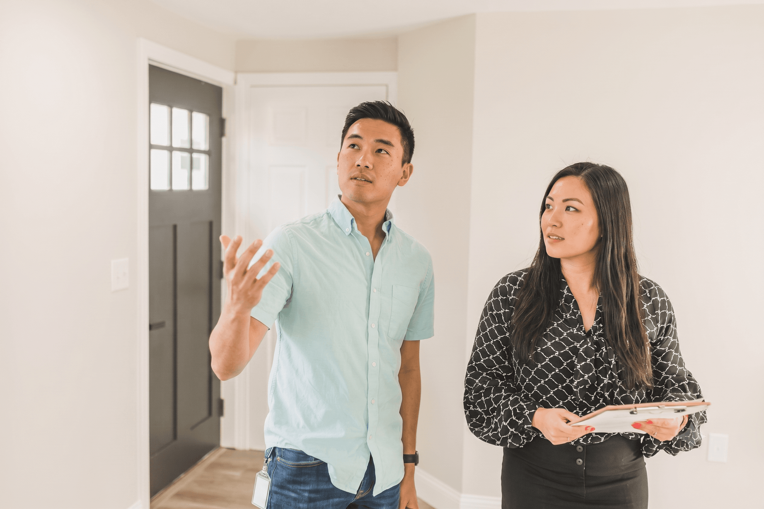 Real estate professionals reviewing property listings